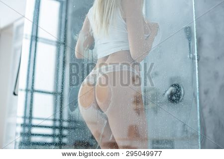 The Girl Pressed Beautiful Sexy Ass In A Thong , Glass Shower Enclosure, Lots Of Drops. Close-up Of 