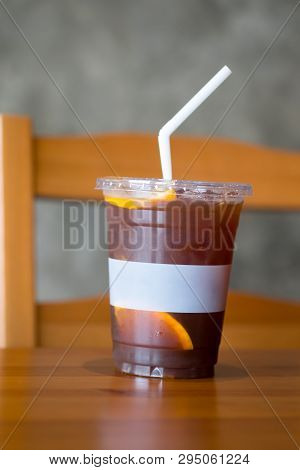 Orange And Coffee Cocktail With Ice On Wood Table