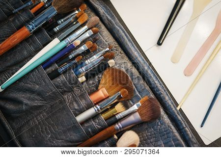Workplace Make-up Artist Special Brushes To Create An Image And Make-up Leather Case On The Table. M