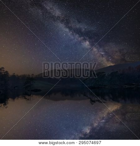 Stunning Landscape Image Of Tarn Hows In Lake District During Beautiful Autumn Fall Evening Sunset W