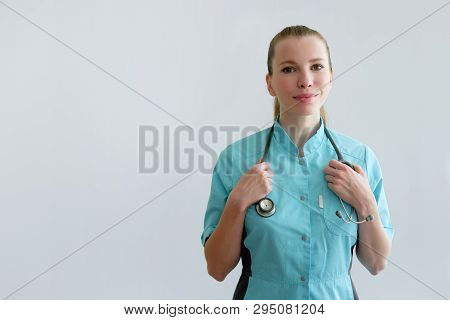 Woman Laborant Working With Microscope Holding Automatic Pipette