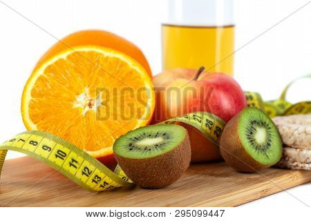 Apple, Orange, Kiwi With Measure Tape On White Background