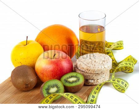 Apple, Orange, Kiwi With Measure Tape On White Background