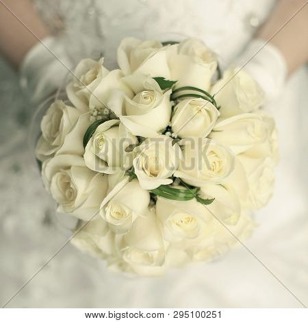 Wedding Bouquet At Bride's Hands. Studio Shot