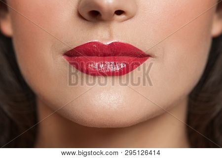 Woman Lips With Red Lipstick Makeup. Beauty Concept