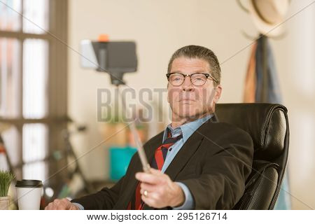 Business Man Taking A Serious Selfie In His Office