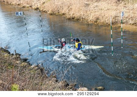 Grodno, Belarus - April, 2019: Kayak Freestyle Competition On Fast Cold Water River Strenuously Rowi