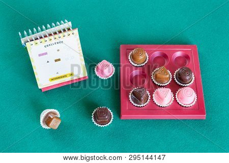 Moscow, Russia - April 2, 2019: Top View Of Set Of Think Fun Chocolate Fix Board Game On Green Baize