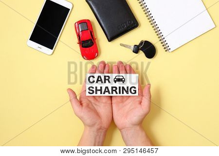 Car Sharing Concept. Human Hands Holding Text Sign 