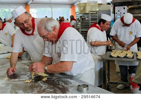 Paris, France - May 16 - Fête Du Pain (holiday Of Bread) Near  Notre-dame, Unidentified Bakers Make