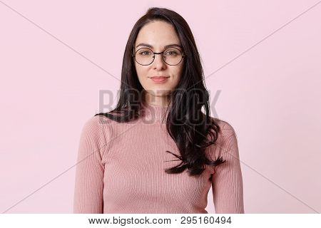 Fashionable Slender Magnetic Woman Wearing Stylish Light Pink Jumper And Stylish Round Spectacles Wh