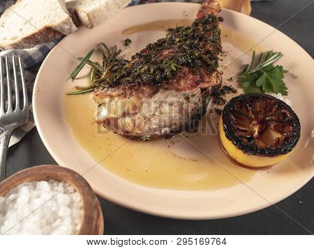 Roasted Sea Bass With Beurre Noir Sauce And Caramelized Lemon