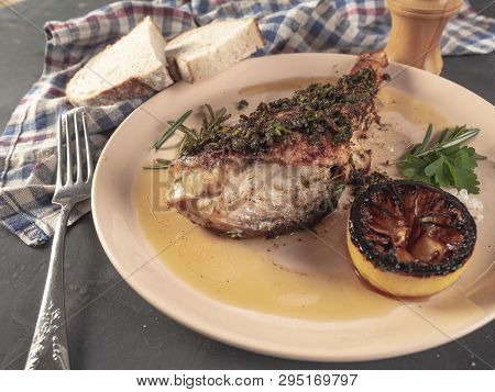 Roasted Sea Bass With Beurre Noir Sauce And Caramelized Lemon