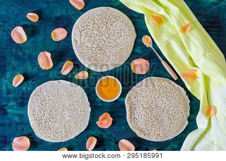 Traditional Moroccan Pancakes Baghrir On Dark Green Wooden Background , Top View , Flat Lay