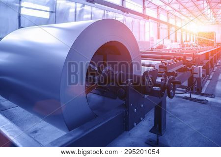 Roll Of Galvanized Steel Sheet At Cutting Machine In Worksop Conveyor Line As Abstract Industrial Eq