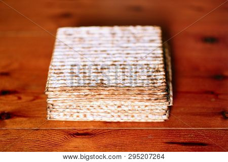 Pile Of Jewish Passover Matzah Unleavened Bread. Symbols Of Passover- Jewish Matza.