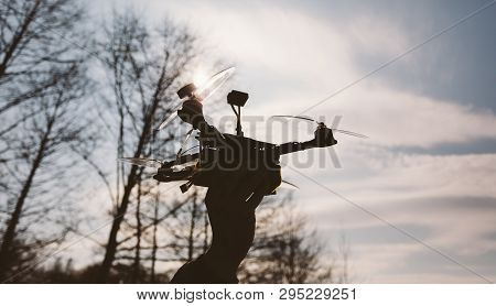 Pilot Racing Drone Holds In His Hand Fpv Copter Before Launching It. A Small High-speed Aircraft Wit