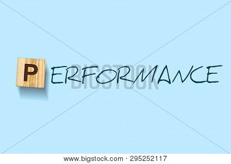 Performance. Words Written On A Wooden Block. Blue Background. Isolated. Business Concept. Performan