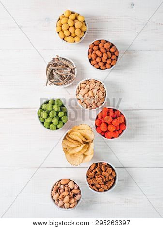 Assortment Of Different Snack For Beer, Wine, Party.peanuts In Coconut Glaze, Green Vasabi, Red Spic