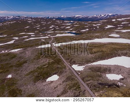 Mountain Region Between Aurland And Laerdal In Norway. Rocky Landscape With Road. National Tourist S