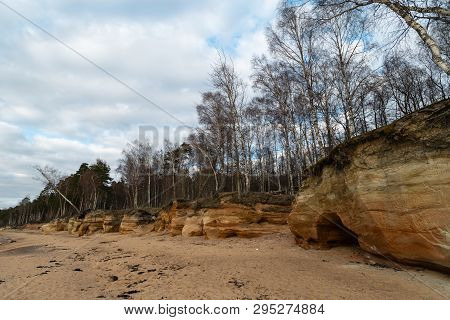 Limestone Beach At The Baltic Sea With Beautiful Sand Pattern And Vivid Red And Orange Color - Touri