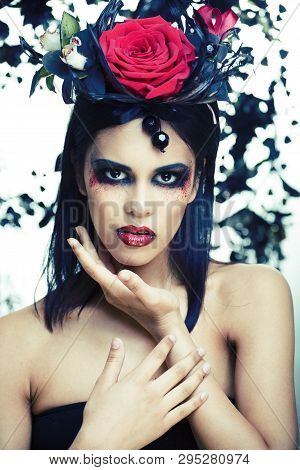 Pretty Brunette Woman With Rose Jewelry, Black And Red, Bright Make Up Kike A Vampire Closeup Red Li