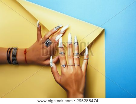 Woman Hands Holding Colorful Paper Copyspace Wearing A Lot Of Jewelry And Long Nails
