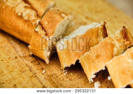 Tasty Baquette Cut On Wooden Cutting Board Close Up Detail