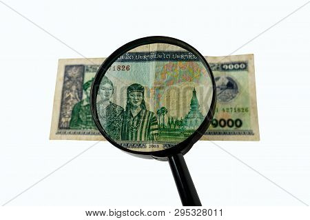 One Thousand Laos Kip Bill And A Magnifying Glass Isolated On A White Background, Obverse Front Side