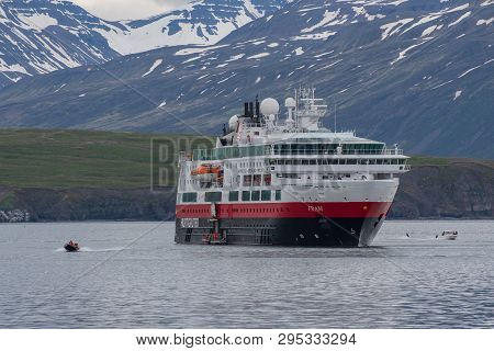 Hrisey, Iceland - June 8. 2018: Cruise Ship Fram From Norwegian Shipping Company Hurtigruten In Eyja