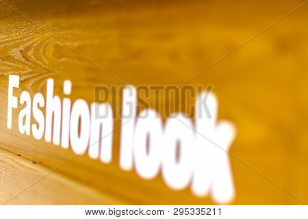 The Fashion Look Word Text Written On On Wooden Background, Quote, Sign, Lettering, Concept, Blurred
