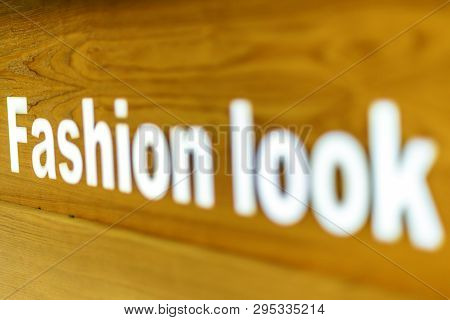 The Fashion Look Word Text Written On On Wooden Background, Quote, Sign, Lettering, Concept, Blurred