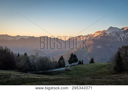 Sunset View From Border Road Of Slovenia And Italy To Mountain Range Krn In Triglav National Park In