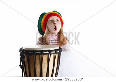 Expressive Toddler Girl Portrait In Rastafarian Hat With Drum