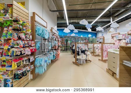 Minsk, Belarus - March 26, 2018: View Of The Toodlers Clothes Section With Brigt And Colorful Bodysu