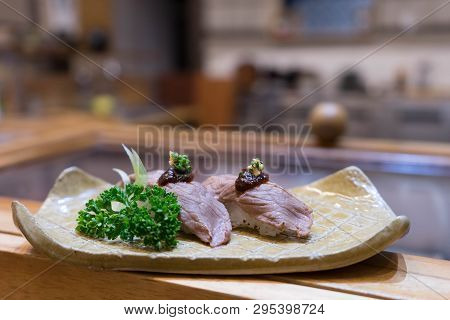 Meat Sushi Nigiri Grilled Or Aburi Served In Brown Plate Decoration With Vegetable On Wooden Table. 