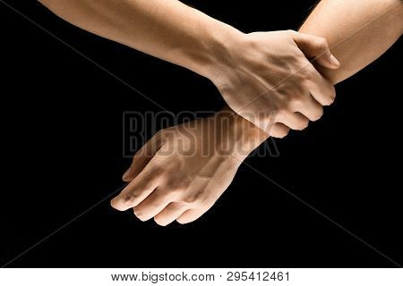 Doubt And Uncertainty. Male Hands Demonstrating A Self Holding Gesture Isolated On Black Studio Back