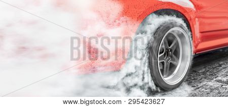 Drag Racing Car Burns Rubber Off Its Tires In Preparation For The Race