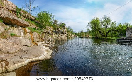 Panoramic View Of The River Section With Rocky Steep Bank In Springtime