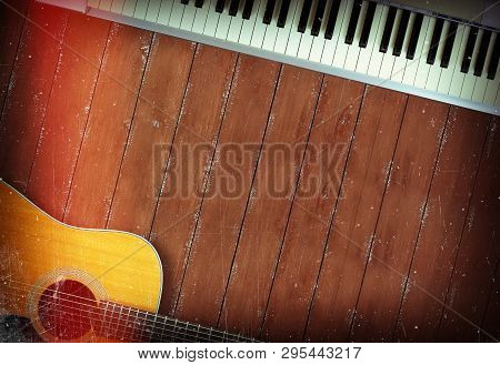 Musical Instrument - Sloseup Midi Piano 61 Key Keyboard And Acoustic Guitar On A Wooden Background