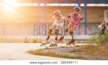Two Girls Training In Speed Skating On Rollerdrome