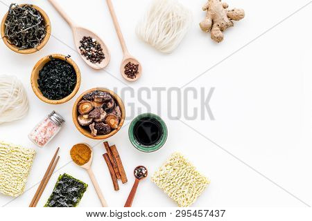 Chinese And Japanese Food Cooking With Ginger, Spices And Noodles On White Background Top View Mocku