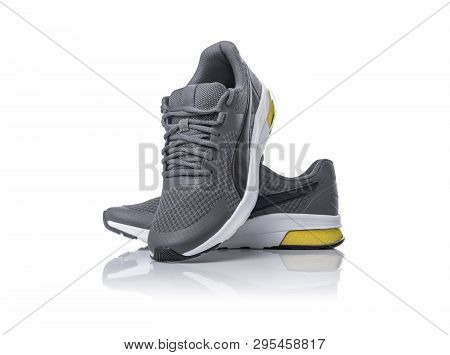 New Unbranded Black Sport Running Shoes Or Sneakers Isolated On White Background.