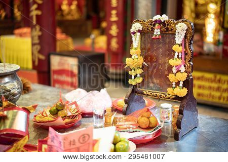 Yaowarat Bangkok, Thailand - 14 April, 2019: Golden Paper, Oil And Fruits On Table Offer For Educati