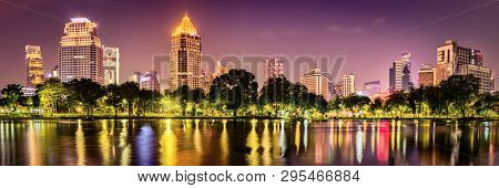 Panoramic view of Bangkok skyline. Night cityscape of Bangkok, Thailand. View from Lumphini park
