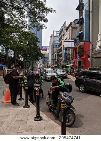 Jakarta, Indonesia - April 7, 2019: Some Drivers Of Ojek Online (taxi Motorbike) Waiting For Passeng