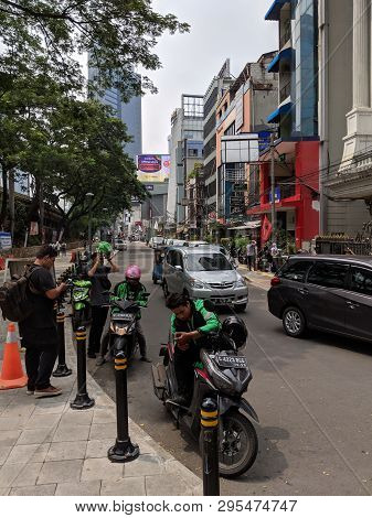 Jakarta, Indonesia - April 7, 2019: Some Drivers Of Ojek Online (taxi Motorbike) Waiting For Passeng