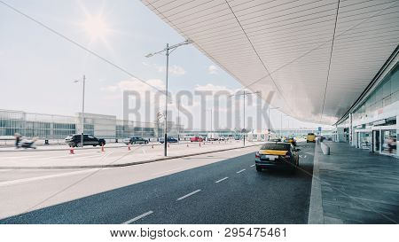 Cabstand In Front Of The Entrance Of Modern Airport In Barcelona, Cab Rank With Several Taxis Near G