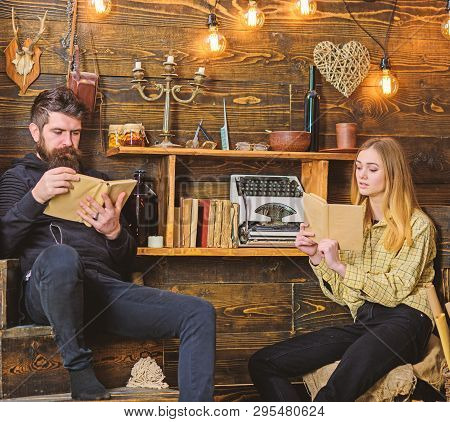 Soulful Evening Concept. Father Instills Love To Books For His Daughter. Girl And Man On Calm Faces 