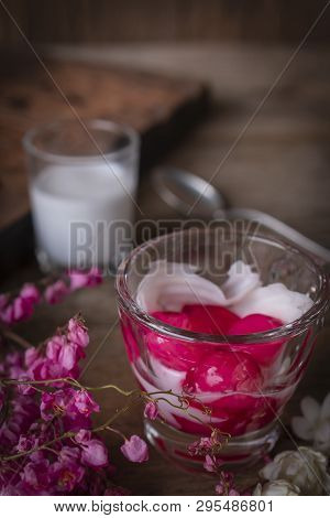 Thapthim Krop, Mock Pomegranate Seeds In Coconut And Syrup In The Glass On The Wood Table There Are 